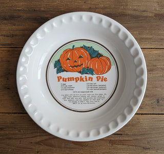 Pumpkin pie dish with recipe and carved pumpkin illustration