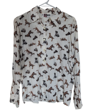 A button-up blouse with a dog pattern, featuring large pearlized buttons, by Simon Chang.