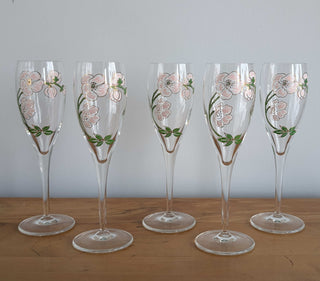Crystal champagne stemware with soft pink florals, light green leaves, and gold lustre, set of 5