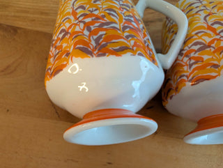 Trio of artisanal ceramic mugs, footed, autumn colors, leafy silhouette decals