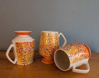 Trio of artisanal ceramic mugs, footed, autumn colors, leafy silhouette decals
