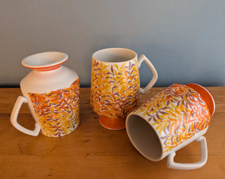 Trio of artisanal ceramic mugs, footed, autumn colors, leafy silhouette decals