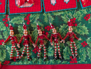 set of 5, beaded miniature nutcracker men with hanging string handmade