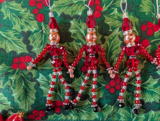 set of 5, beaded miniature nutcracker men with hanging string handmade