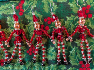 set of 5, beaded miniature nutcracker men with hanging string handmade