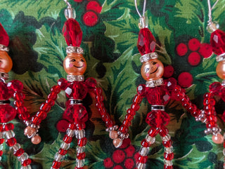 set of 5, beaded miniature nutcracker men with hanging string handmade