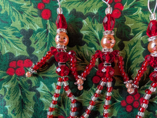 set of 5, beaded miniature nutcracker men with hanging string handmade