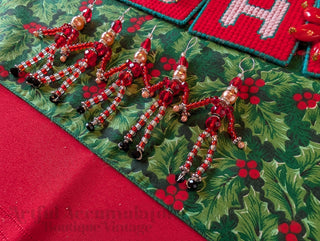 set of 5, beaded miniature nutcracker men with hanging string handmade
