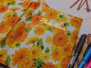 Retro orange & yellow floral photo album with gold title, holds 48 4 5/8 x 3 1/4 photos, album removable from cover -  - #tag1# - #tag2# - #tag3# - #tag4# - the Artful Accumulator's Vintage Boutique