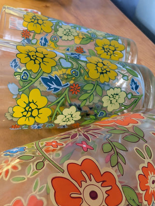Trio of medium-sized tumblers with orange and green floral patterns - Artful Accumulator Boutique Vintage