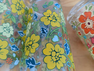 Trio of medium-sized tumblers with orange and green floral patterns - Artful Accumulator Boutique Vintage