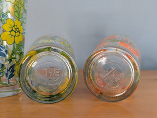 Trio of medium-sized tumblers with orange and green floral patterns - Artful Accumulator Boutique Vintage