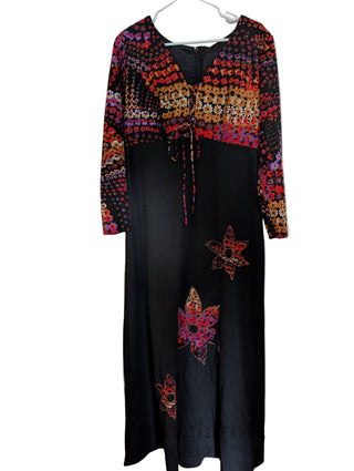 long vintage autumnal dress with multicolour top in warm colours with a black maxi skirt