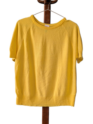 Yellow sweater on a hanger against a gray background with 'Artful Accumulator Boutique Vintage' branding.