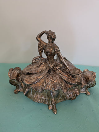 Weidlich Brothers silver casket jewelry box with a woman in a dress holding a hand mirror