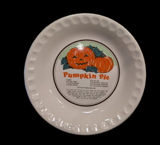 Pumpkin pie dish with recipe and carved pumpkin illustration
