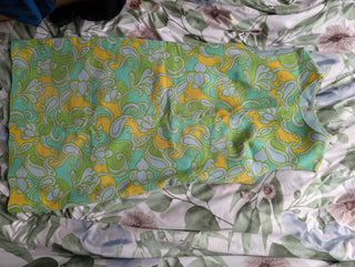 Mod style vintage dress in light blue, green, and yellow. lined