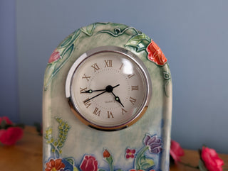 Ceramic Clock, Arch shaped, floral imagery with subtle 3d effect