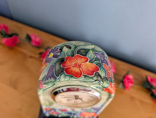 Ceramic Clock, Arch shaped, floral imagery with subtle 3d effect