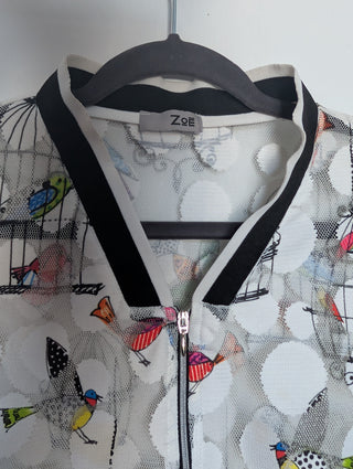 white tulle mesh with circles, zip up see through cardigan with colorful flying birds and bird cages