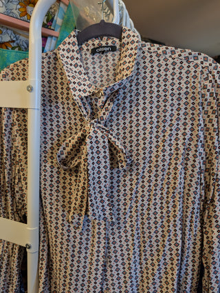 bow tie neck, flower, dot, and diamond pattern print button up blouse with pearlized buttons