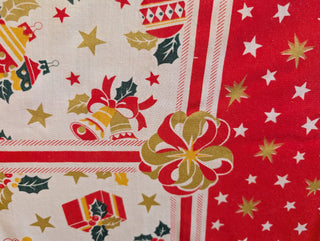 Audrey - Rectangle tablecloth - Festive pattern with scalloped red edge, stars, holly, santa, christmas presents
