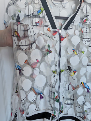 white tulle mesh with circles, zip up see through cardigan with colorful flying birds and bird cages