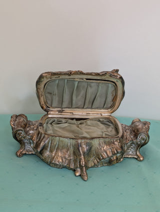 Weidlich Brothers silver casket jewelry box with a woman in a dress holding a hand mirror