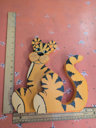 adorable orange cartoon tiger with black stripes on wood, signed on the back