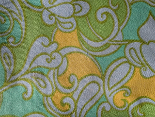 Mod style vintage dress in light blue, green, and yellow. lined